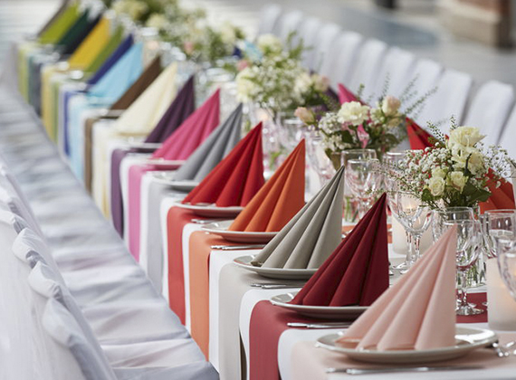 Assortment of premium coloured napkins on a banquet table