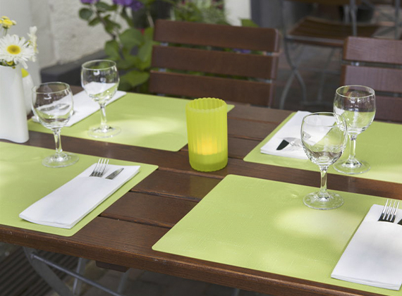 Bright kiwi silicone placemat used for outdoor dining